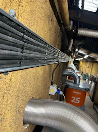 a pipe is attached to a wall in a factory