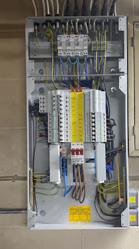 a large electrical panel with many wires and wires
