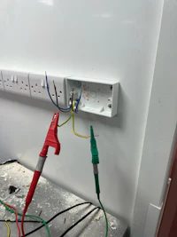 a white wall with wires attached to it